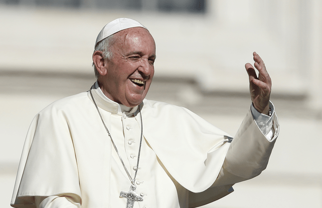 Pope Francis gestures as he leaves his general audience in St. Peter's Square at the Vatican Oct. 11. (CNS photo/Paul Haring)